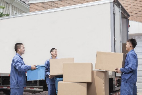 Family home moving preparations with labeled boxes in Acton