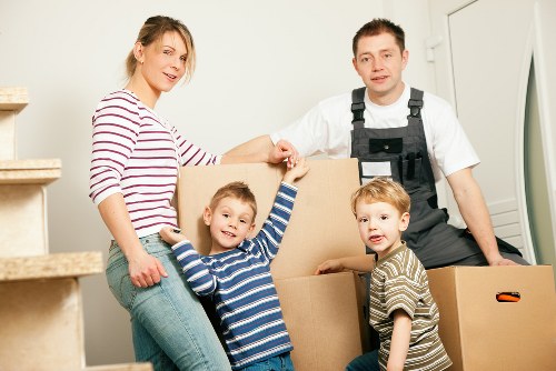 Local removals van navigating residential streets in Acton