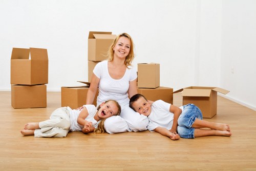 Professional moving team completing a safe Acton van service