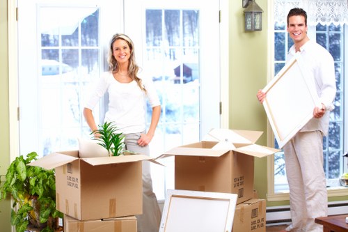 Careful unpacking and organisation after a move in Acton