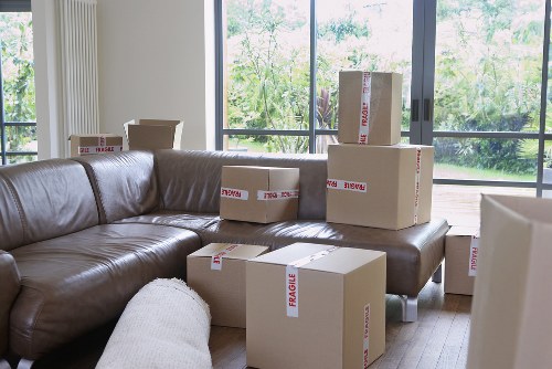 Professional movers handling desks and office furniture in Acton