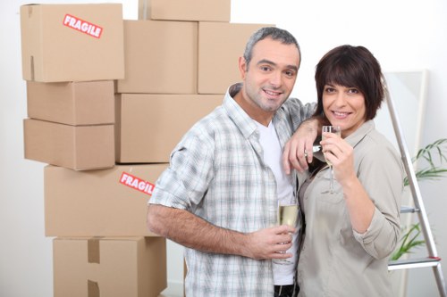 Local removal van loading items for an Acton property move